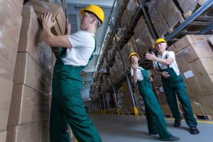 workers in a warehouse block stacking